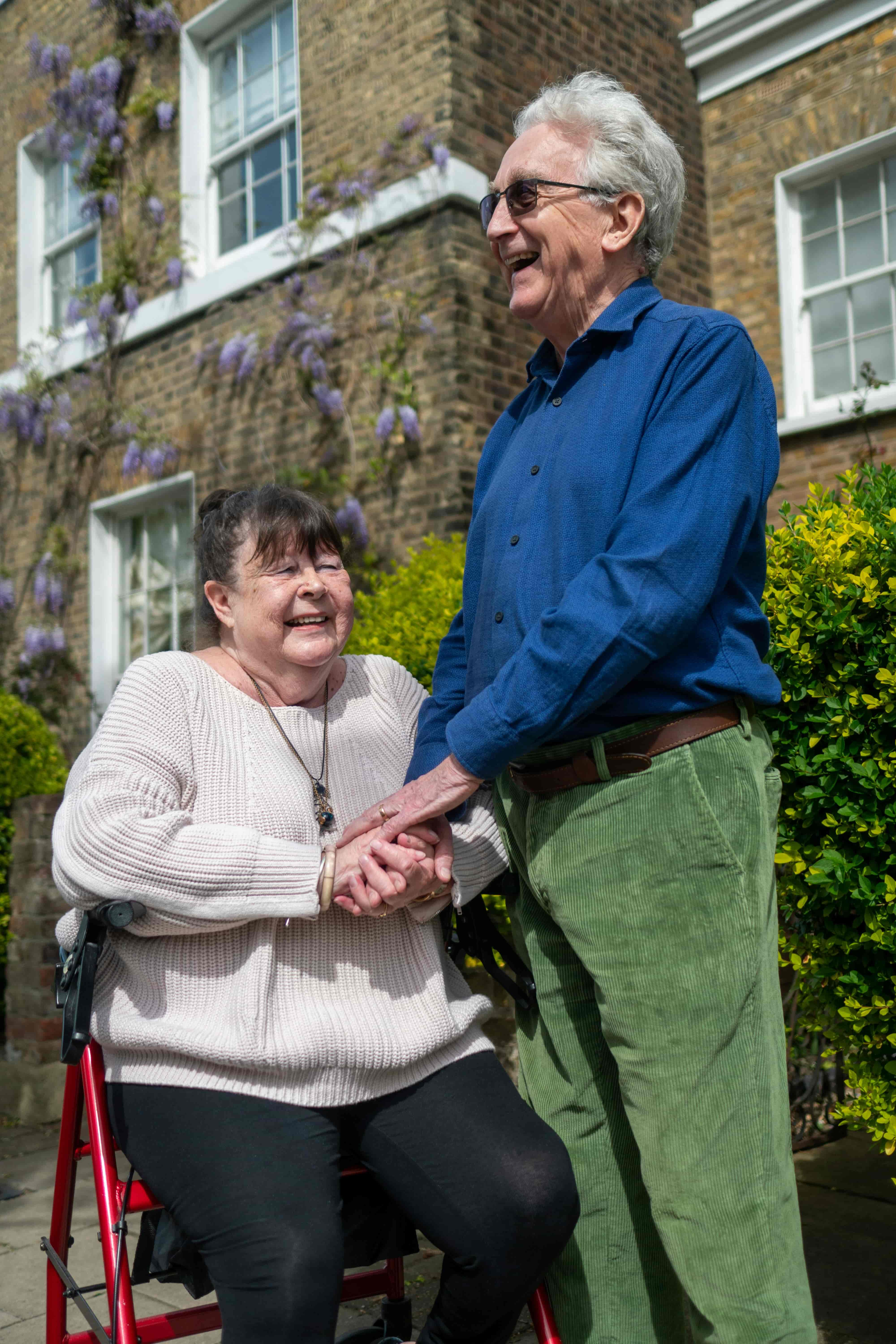 Caregiver smiling with a resident